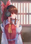  1girl absurdres ascot beyerdynamic bow brown_hair closed_mouth commentary_request detached_sleeves frilled_bow frilled_hair_tubes frills hair_bow hair_tubes hakurei_reimu headphones highres long_hair red_bow red_eyes smile solo taguno touhou window yellow_ascot 
