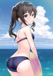  1girl ass back bare_shoulders bikini black_hair blue_bikini blue_sky blurry blurry_background blush brown_eyes cloud cowboy_shot day dot_nose from_behind hair_between_eyes holding holding_swim_ring horizon idolmaster idolmaster_cinderella_girls idolmaster_cinderella_girls_starlight_stage looking_at_viewer looking_back mole mole_under_eye ocean outdoors parted_lips sakura_ran sky solo sparkle standing sunazuka_akira swim_ring swimsuit twintails 