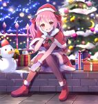  1girl absurdres blush boots box capelet christmas christmas_tree fence fur-trimmed_boots fur-trimmed_capelet fur-trimmed_gloves fur-trimmed_skirt fur_trim gift gift_box gloves grin hand_on_own_cheek hand_on_own_face hat highres holding holding_gift indie_virtual_youtuber koisaki_luna long_hair looking_at_viewer orange_eyes pink_hair santa_hat sitting skirt smile snow snowman solo string_lights thighhighs two_side_up virtual_youtuber yodakeke 