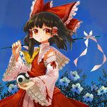  ascot ball black_hair blue_background detached_sleeves flower hair_tubes hakurei_reimu holding long_hair looking_at_viewer red_eyes skirt solo touhou uma_(ninjin_misaki) yin_yang 