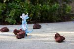 2015 3d_(artwork) ambiguous_gender anthro blue_body blue_fur digital_media_(artwork) domestic_cat felid feline felis fur mammal naircat outside photo plant real rock solo
