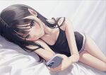  1girl bare_arms bare_shoulders bed_sheet black_camisole black_hair blush bow bow_panties breasts brown_eyes camisole cellphone closed_mouth commentary dutch_angle highres holding holding_phone long_hair looking_at_viewer lying on_side original panties phone purple_panties small_breasts solo thigh_gap underwear underwear_only yukiyama_momo 