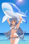  1girl beach bikini breasts day grey_hair hair_ribbon highres inflatable_shark inflatable_toy kantai_collection long_hair looking_at_viewer medium_breasts murakumo_(kancolle) ocean ribbon shark smile solo sunlight swimsuit water white_bikini zosho 