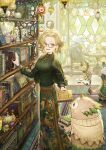  1girl absurdres belt bird blonde_hair book bookshelf breasts cup day earrings fantasy figure floating floral_print flower frog glasses green_shirt green_skirt highres holding holding_book indoors jewelry lamp levitation long_skirt long_sleeves medium_breasts necklace open_mouth original painting_(object) rug shirt sho_(sumika) skirt stained_glass standing sweater table teacup teapot vase 