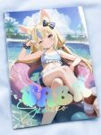  1girl ahoge animal_ear_fluff animal_ears animal_print bare_shoulders bikini blonde_hair blue_bikini blue_bow blue_eyes blue_nails blue_sky blue_streaks blunt_bangs blush bow cat_ears character_name commentary_request day fins fish_girl fish_print fish_tail grin hair_bow happy highres indie_virtual_youtuber lifebuoy_anklet lifebuoy_hair_ornament lokyin_house long_hair multicolored_hair navel on_innertube one_eye_closed outdoors palm_tree paper_boat parasol photo_(medium) pool sameko_saba sameko_saba_(1st_costume) sky smile solo stomach streaked_hair striped_bikini striped_clothes swim_ring swimsuit tail teeth tree twintails umbrella virtual_youtuber water 