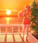  1girl absurdres bangle bare_legs bracelet brown_sandals cloud cloudy_sky english_commentary food fruit highres horizon jewelry knees legs log_pose long_hair looking_to_the_side mandarin_orange nami_(one_piece) necklace neo_uma ocean official_alternate_costume one_piece orange_eyes orange_hair orange_overalls orange_sky orange_tree outdoors overall_shorts overalls parted_lips pearl_necklace railing sandals sky smile solo standing sun sunset sweater thighs turtleneck turtleneck_sweater wavy_hair yellow_sweater 