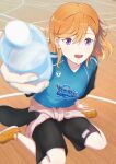  1girl absurdres black_shorts blue_shirt bottle clothes_around_waist commentary_request date_sayuri highres holding holding_bottle indoors jacket jacket_around_waist long_hair looking_at_viewer love_live! love_live!_superstar!! open_mouth orange_hair orange_shoes school_gym shibuya_kanon shirt shoes shorts sitting solo tuyuyohe5077 voice_actor_connection wariza water_bottle 