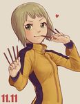  abe_(f!mixture) bad_id bad_pixiv_id between_fingers blonde_hair bruce_lee's_jumpsuit food green_eyes heart huang_baoling pocky pocky_day short_hair solo tiger_&amp;_bunny 