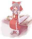  food hakurei_reimu mouth_hold numako sitting solo tea touhou veranda yukkuri_shiteitte_ne 