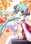  detached_sleeves green_eyes green_hair hatsune_miku japanese_clothes long_hair miko sitting skywaker solo thighhighs twintails very_long_hair vocaloid 