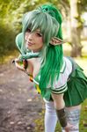  1girl armor breasts cleavage cosplay echidna echidna_(cosplay) elf female green_hair green_nails highres k-a-n-a kana large_breasts nail_polish photo pointy_ears queen&#039;s_blade queen's_blade snake solo 