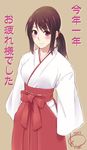  2012 artist_name blush brown_hair dated hakama highres japanese_clothes korisei miko new_year new_year's_eve original ponytail red_eyes red_hakama scrunchie signature simple_background smile solo 