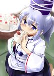  blue_eyes cake eating food fruit haji_(hajiko) hat japanese_clothes kariginu long_hair mononobe_no_futo ponytail silver_hair skirt solo strawberry tate_eboshi touhou 