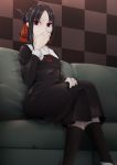  1girl aiyat_@_maotto bangs black_dress black_hair black_legwear blurry breasts checkered checkered_background collarbone couch dress eyebrows folded_ponytail hair_ribbon hand_up highres indoors kaguya-sama_wa_kokurasetai_~tensai-tachi_no_renai_zunousen~ kneehighs legs_crossed long_sleeves looking_at_viewer red_eyes ribbon school_uniform shinomiya_kaguya short_hair sitting small_breasts solo 