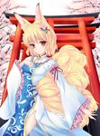  animal_ears blonde_hair blush cherry_blossoms fox_ears fox_tail fred0092 highres looking_at_viewer red_eyes short_hair solo tail torii touhou yakumo_ran 