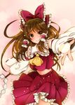  ascot bow brown_eyes brown_hair colorized detached_sleeves gohei hair_bow hair_tubes hakurei_reimu highres light_particles long_hair looking_at_viewer mameshiba_(skydropb) midriff navel open_hand outstretched_arm pink_background skirt skirt_set smile solo touhou 