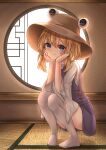  1girl absurdres ass blonde_hair blue_eyes blush brown_headwear closed_mouth hat highres indoors long_sleeves looking_at_viewer medium_hair moriya_suwako round_window shirt smile solo squatting thighhighs touhou tsubakipan white_shirt white_thighhighs wide_sleeves window 