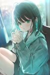  1girl :o black_shorts blurry blurry_background blush bokeh borrowed_clothes brown_hair coat colored_inner_hair commentary_request couch cup curtains depth_of_field ear_ornament green_coat green_eyes green_hair holding holding_cup indoors knees_up long_sleeves looking_at_viewer multicolored_hair on_couch original parted_lips shorts sitting sleeves_past_wrists solo water_drop yukimaru_nun 