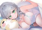  1girl =_= armpit_peek babydoll bare_shoulders blue_babydoll blunt_bangs blush bow bow_choker breasts choker cleavage commentary_request creature dan'in-san_(shirogane_noel) dokkumaa green_eyes grey_hair hair_bun hair_ornament hairpin highres hololive jewelry large_breasts light_smile looking_at_viewer lying necklace o-ring official_alternate_costume official_alternate_hairstyle on_side shirogane_noel shirogane_noel_(9th_costume) single_hair_bun sleepwear solo thighs under_covers very_low_bun virtual_youtuber 