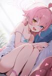  1girl absurdres ahoge ass blue_archive blue_eyes blush camisole fang feet_out_of_frame hair_between_eyes halo heterochromia highres hoshino_(blue_archive) loloco long_hair lying on_side open_mouth pink_hair pink_halo solo white_camisole yellow_eyes 