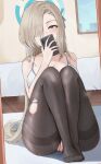  absurdres asuna_(blue_archive) bare_shoulders bed black_pantyhose blonde_hair blue_archive blue_eyes cellphone cellphone_photo fluffyebi01 hair_over_one_eye halo highres holding holding_phone indoors long_hair mirror pantyhose phone picture_frame sitting steam steaming_body torn_clothes torn_pantyhose window 