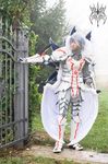  autumn breastplate concrete cosplay costume fog gate gauntlets gloves grass greaves hair hair_over_eyes monster_hunter pine_tree real shoulder_guards sidewalk silver_hair spikes standing tree turtleneck video_games white_hair wings 