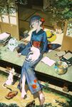  1girl absurdres barefoot black_hair blue_kimono book book_stack cat earrings fish fishbowl flat_chest flower full_body geta goldfish green_eyes hair_bun hair_flower hair_ornament hand_fan highres japanese_clothes jewelry kanzashi kimono looking_at_viewer original paper_fan shiomi_(lowrise) shoes sitting smile solo sunlight tassel tassel_hair_ornament toes uchiwa unworn_shoes veranda 