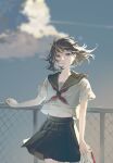  1girl arm_at_side black_eyes black_hair black_sailor_collar black_skirt chain-link_fence closed_mouth cloud commentary_request cowboy_shot fence floating_hair hand_rest highres holding holding_shoes holding_unworn_clothes lips looking_at_viewer medium_hair multicolored_hair navel_peek neckerchief original outdoors pleated_skirt red_neckerchief sailor_collar school_uniform serafuku shirt shoes short_sleeves sidelighting skirt sky solo streaked_hair sunlight sushirice_0 unworn_shoes uwabaki white_shirt white_shoes wind 