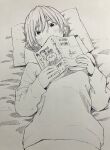  1girl blush book commentary_request covering_own_mouth cowboy_shot greyscale hair_between_eyes head_on_pillow highres holding holding_book hood hood_down hoodie long_sleeves lying monochrome on_back on_bed open_book original parted_bangs pen_(medium) photo_(medium) pillow solo traditional_media translation_request yoshimizm 