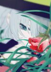  1girl absurdres commentary flower grass green_eyes green_hair highres komeiji_koishi looking_at_object lying on_stomach plant red_flower red_rose rose solo touhou xianjian_lingluan 