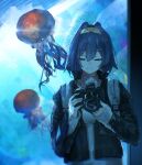  1girl absurdres advarcher alternate_costume aquarium black_jacket blue_hair camera closed_eyes closed_mouth commentary facing_viewer grem_(gigi_murin) hair_intakes hairband highres holding holding_camera hololive hololive_english indoors jacket jellyfish long_sleeves open_clothes open_jacket ouro_kronii short_hair smile solo sweater turtleneck turtleneck_sweater untranslatable_commentary upper_body virtual_youtuber white_sweater yellow_hairband 