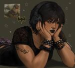  arm_tattoo arrow_(symbol) artist_name batman_(series) batman_symbol black_hair black_lips black_shirt bracelet brown_eyes cassandra_cain ciricearts commentary dc_comics english_commentary face_piercing fingernails green_background hair_between_eyes head_on_hands headphones highres jewelry lace_shirt lying multiple_bracelets multiple_rings nail_polish nose_piercing nose_ring on_stomach pants piercing purple_pants reference_inset ring scrunchie shirt short_sleeves star_(symbol) studded_bracelet studs tattoo twitter_username wrist_scrunchie 