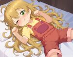  1girl ahoge amaama_to_inazuma bed blush brown_hair brown_overalls clenched_hands commentary english_commentary eroneko_senpai green_eyes inuzuka_tsumugi long_hair looking_at_viewer lying on_back one_eye_closed overall_shorts overalls paw_pose pillow shirt short_sleeves smile solo spread_legs tongue tongue_out variant_set yellow_shirt 