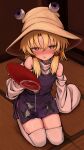  1girl absurdres alcohol animal_print blonde_hair blush brown_hat clothing_cutout commentary_request cup drunk frog_print hair_ribbon hat highres holding holding_cup long_sleeves looking_at_viewer miniskirt moriya_suwako neritch purple_skirt purple_vest red_ribbon ribbon sakazuki sake seiza shoulder_cutout sitting skirt solo tatami thighhighs thighs touhou tress_ribbon vest wet wet_clothes wet_skirt white_thighhighs wide_sleeves yellow_eyes 