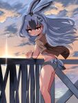  1girl animal_ears beach bikini bracelet extra_ears grey_hair hair_ornament highres jewelry kemono_friends long_hair looking_at_viewer mcgunngu outdoors rabbit_ears rabbit_girl rabbit_tail ribbon shirt snowshoe_hare_(kemono_friends) solo swimsuit tail yellow_eyes 