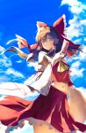 1girl ascot black_hair blue_sky bow cloud cloudy_sky commentary_request crop_top crop_top_overhang detached_sleeves frilled_bow frilled_hair_tubes frilled_skirt frills fuwaita hair_bow hair_tubes hakurei_reimu highres holding holding_ofuda long_hair looking_at_viewer midriff navel ofuda red_bow red_shirt red_skirt ribbon-trimmed_sleeves ribbon_trim shirt skirt sky solo standing touhou wide_sleeves yellow_ascot 