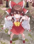  1girl :t absurdres blush bow bowtie breasts brown_eyes brown_hair cherry_blossoms chinese_commentary closed_mouth commentary_request detached_sleeves frilled_bow frilled_hair_tubes frills full_body hair_bow hair_tubes hakurei_reimu hands_on_own_hips highres liam_(pixiv_128272830) long_hair looking_at_viewer making-of_available ofuda outdoors pout red_bow red_shoes red_skirt ribbon-trimmed_sleeves ribbon_trim shoes skirt skirt_set small_breasts socks solo torii touhou white_socks yellow_bow yellow_bowtie 