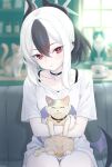  1girl black_choker black_hair blue_archive cat choker closed_mouth collarbone commentary_request couch demon_horns ear_piercing hair_between_eyes halo highres horns indoors kayoko_(blue_archive) looking_at_viewer medium_hair on_couch piercing ponytail red_eyes shirt single_wing sitting solo teina white_hair white_shirt wings 