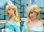  bare_shoulders blonde_hair cosplay crown dress hair_over_one_eye mario_(series) nintendo photo rosetta_(mario) smile super_mario_bros. wand 