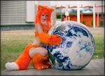  cosplay costume enjinight female firefox fox fursuit globe human looking_at_viewer mammal real solo world 