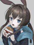  1girl absurdres amiya_(arknights) animal_ear_fluff animal_ears arknights ascot black_jacket blue_ascot blue_collar blue_eyes brown_hair burger collar commentary food food_wrapper hair_intakes highres holding holding_burger holding_food hood hooded_jacket jacket jewelry kkamkkam long_hair long_sleeves looking_at_viewer low_ponytail multiple_rings open_clothes open_jacket open_mouth ponytail rabbit_ears rabbit_girl ring ringed_eyes solo symbol-only_commentary teeth upper_body upper_teeth_only 