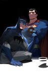  2boys batman batman_(series) belt black_background black_hair blue_cape blue_eyes cape chocolate_donut cowl crossed_arms cup dc_comics disposable_coffee_cup disposable_cup donut food highres interrogation intimidation looking_at_viewer male_focus multiple_boys muscular muscular_male red_cape sitting sitting_on_table superhero_costume superman superman_(series) white-corner 