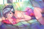  ass black_eyes black_hair breasts camisole cleavage couch cushion glasses headphones lips lying on_stomach original osamu panties small_breasts smile solo strap_slip striped striped_panties underwear 