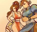  2girls bracelet breasts brown_hair capcom capcom_vs_snk chun-li crossover double_bun fan fatal_fury jewelry large_breasts multiple_girls ponytail shiranui_mai snk spiked_bracelet spikes street_fighter 