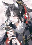  1boy animal_ear_fluff animal_ears black_hair black_hanfu blush branch chinese_clothes falling_petals fox_ears grey_eyes hanfu high_ponytail highres holding holding_branch long_hair looking_down modao_zushi open_mouth petals smile solo tassel wei_wuxian white_som 