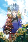  1girl absurdres blue_sky blurry book braid chinese_clothes chinese_text cloud crown day flower highres hmong holding long_hair long_sleeves looking_at_viewer miao_clothes miao_hat original outdoors plant qiushiri red_eyes sky smile solo 
