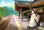  1girl absurdres bag brown_eyes brown_hair dress fixed hat highres landscape nabana outdoors railroad_tracks solo train_station 