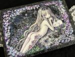  1girl acrylic_paint_(medium) ass bird blonde_hair bug butterfly commentary_request cup expressionless flower green_eyes highres long_hair looking_at_viewer lying nude on_stomach original painting_(medium) pale_skin petals photo_(medium) pocket_watch rose solo sumire_shisei teacup traditional_media very_long_hair watch white_rabbit_(animal) 