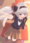  1girl alternate_costume arm_support black_bow black_bowtie black_cardigan black_hairband blue_eyes bow bow_hairband bowtie brown_skirt cardigan classroom commentary_request desk hairband highres hitodama indoors kneehighs konpaku_youmu konpaku_youmu_(ghost) looking_at_viewer on_desk open_mouth plaid_clothes plaid_skirt pointing pointing_at_viewer rital school_uniform shirt short_hair skirt socks solo touhou twitter_username white_hair white_shirt 
