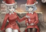  2girls alternate_costume armchair black_pantyhose chair christmas clock commentary_request couch dress eila_ilmatar_juutilainen green_eyes grey_hair hat highres holding indoors long_hair looking_at_another memory_(prophet5) multiple_girls on_couch open_mouth pantyhose sack santa_costume santa_dress santa_hat sanya_v._litvyak sitting strike_witches white_hair white_pantyhose world_witches_series 